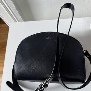 APC Demi Lune bag in black with gold hardware